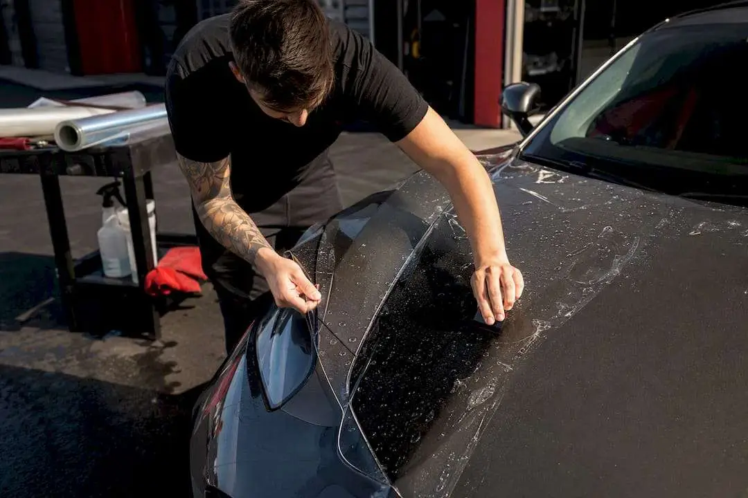 Applying paint protection film on car hood and fender