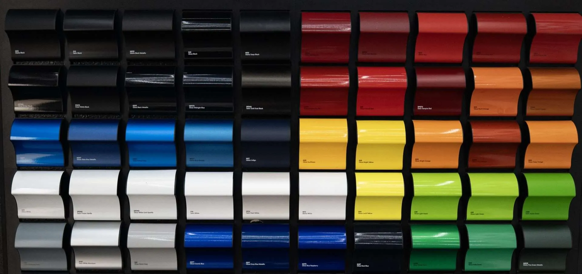 The selected black, white, gray, blue, red, orange, yellow and green vinyl film samples included in the $2,199 promotion.